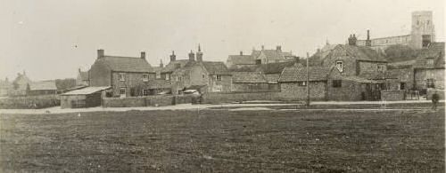 houses on the village green before they were damaged by the 1953 flood